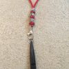 Red lanyard and dog whistle